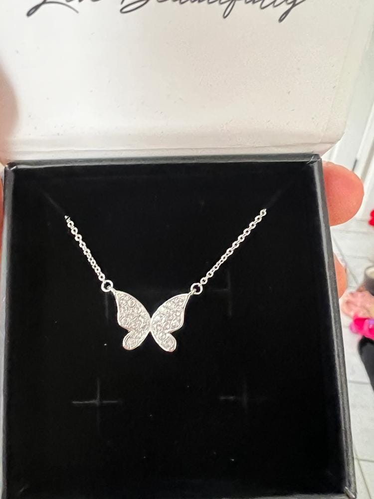 Customer photo review of Yuenen 18k White Gold Plated Butterfly Necklace with Swarovski Crystals & Heartfelt Message for Daughter