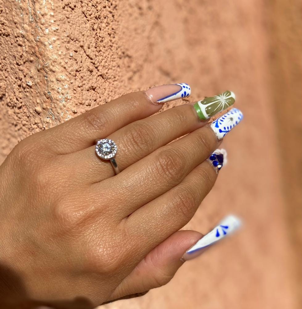 Customer photo review of Moissanite by Cate & Chloe Cora 1.1tcw Round Cut 925 Sterling Silver 18k White Gold Plated Forever Engagement Ring