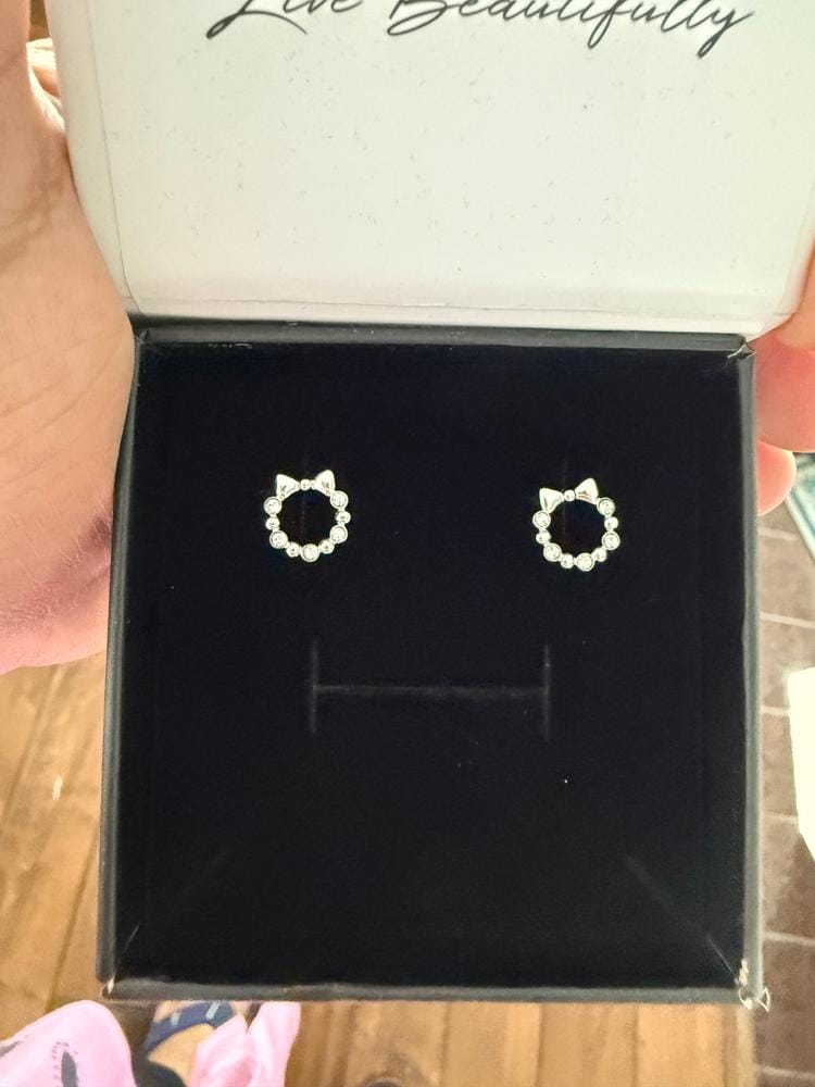 Customer photo review of Edith 18k White Gold Plated Silver Ribbon Stud Earrings with Swarovski Crystals