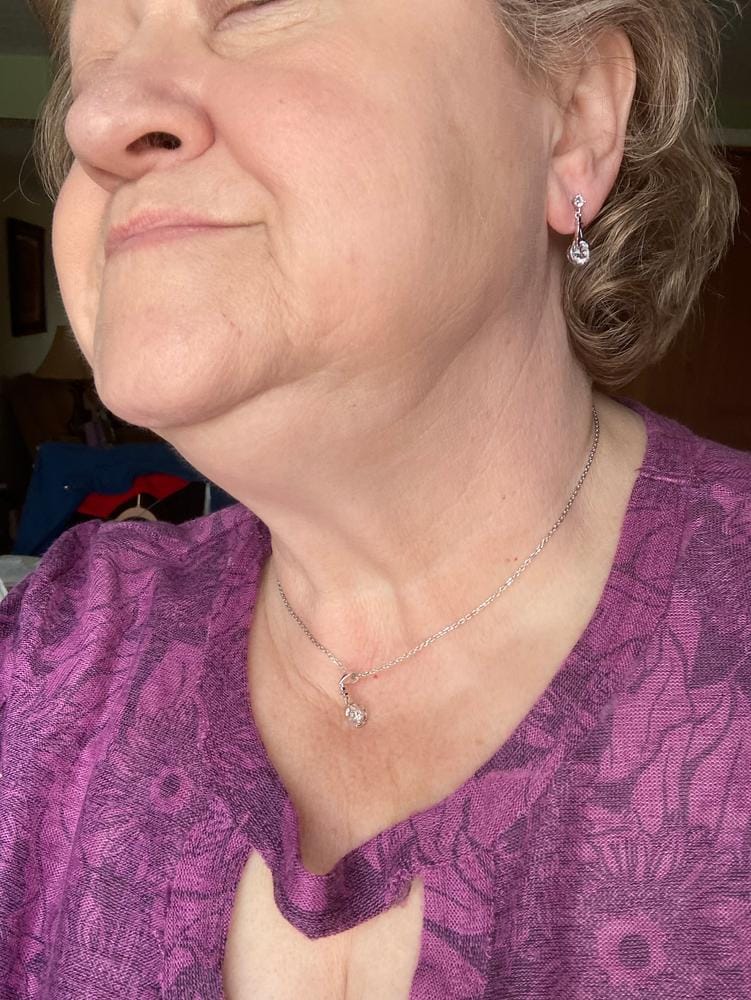 Customer photo review of Isla 18k White Gold Plated Dangle Earrings with Round Swarovski Crystals