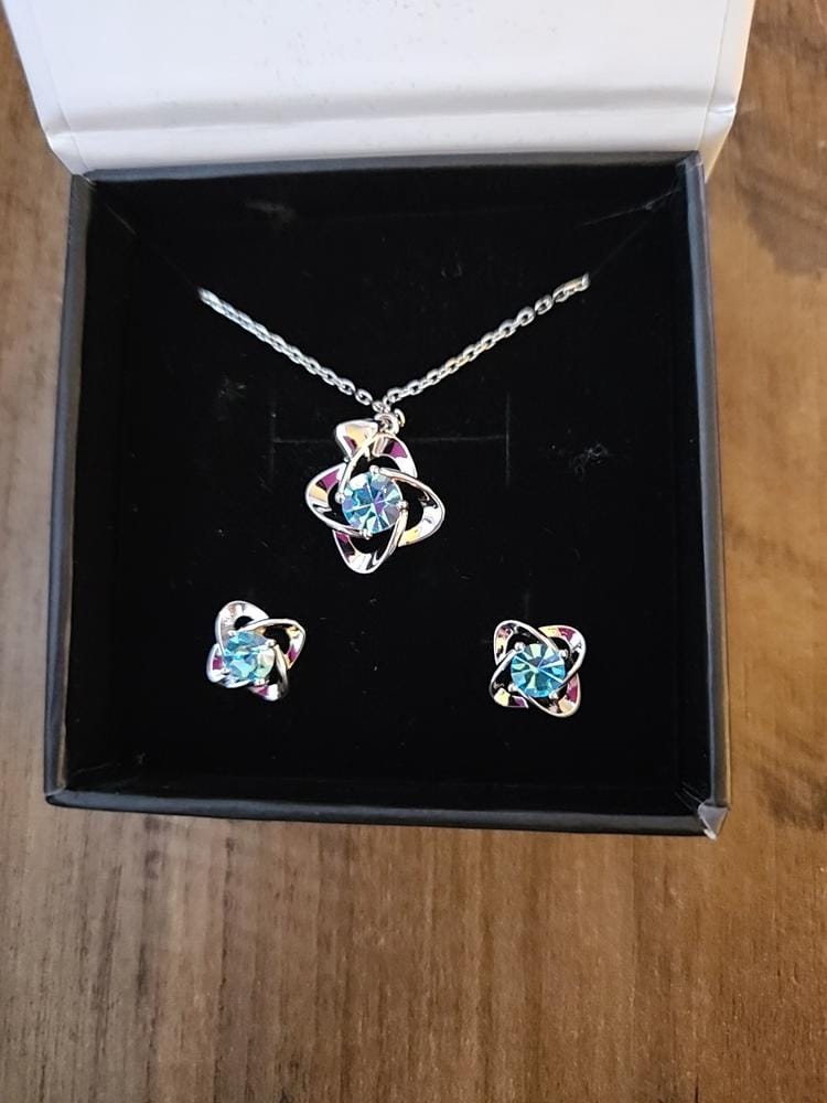 Customer photo review of Infinity 18k White Gold Plated Birthstone Flower Earrings with Swarovski Crystals