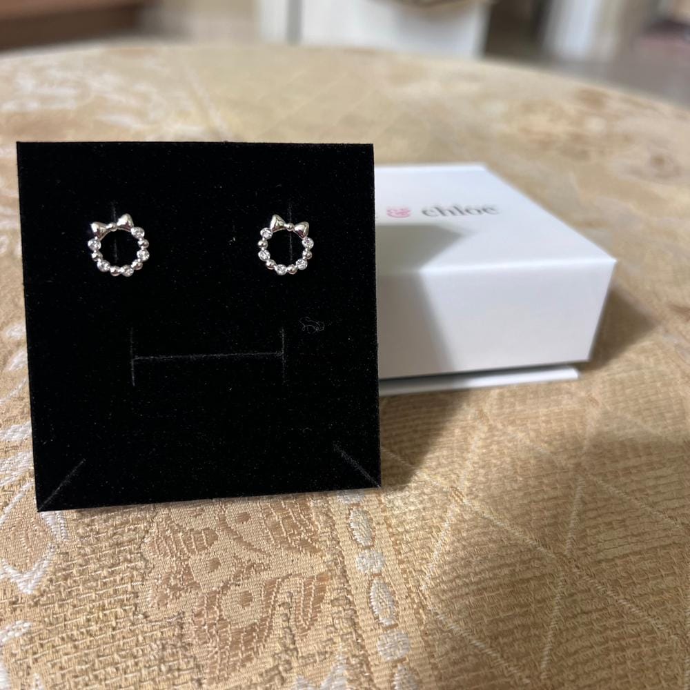 Customer photo review of Edith 18k White Gold Plated Silver Ribbon Stud Earrings with Swarovski Crystals