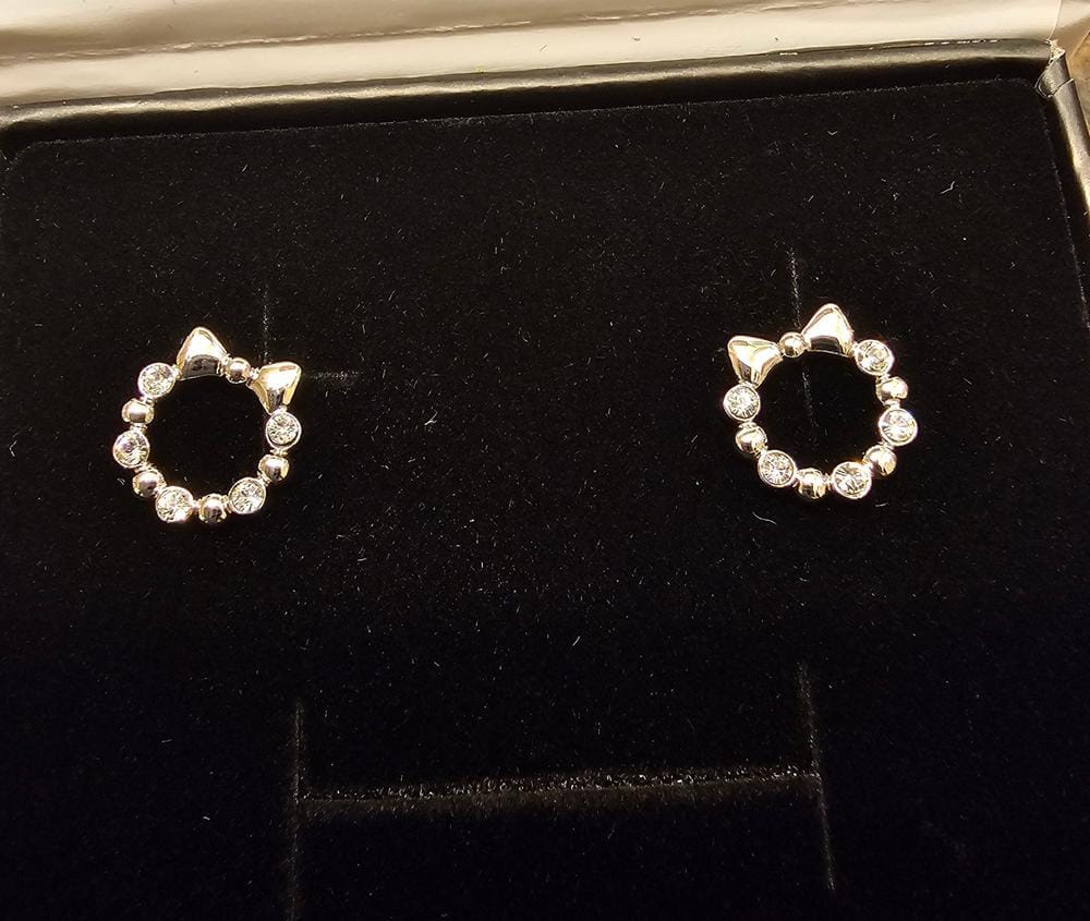 Customer photo review of Edith 18k White Gold Plated Silver Ribbon Stud Earrings with Swarovski Crystals