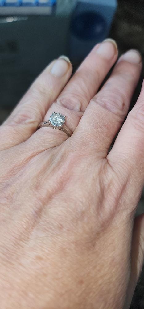 Customer photo review of Moissanite by Cate & Chloe Abigail 1.0tcw Round Cut 925 Sterling Silver 18k White Gold Plated Engagement Ring