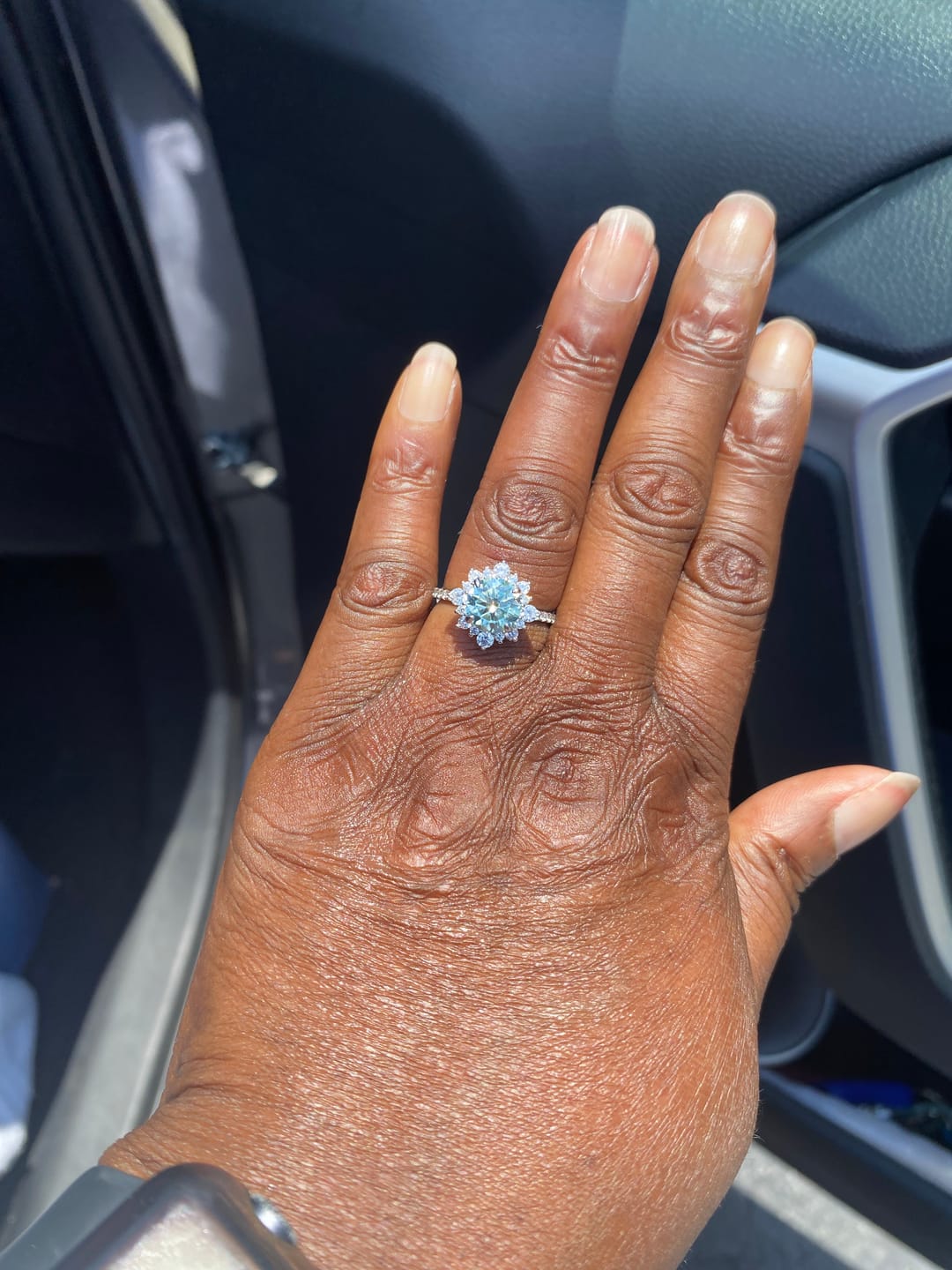 Customer photo review of S925 Moissanite 2 Ct Snowflake Design Halo Round Cyan Blue Stone Engagement Ring