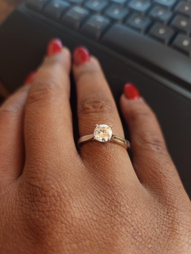 Customer photo review of Moissanite by Cate & Chloe Abigail 1.0tcw Round Cut 925 Sterling Silver 18k White Gold Plated Engagement Ring