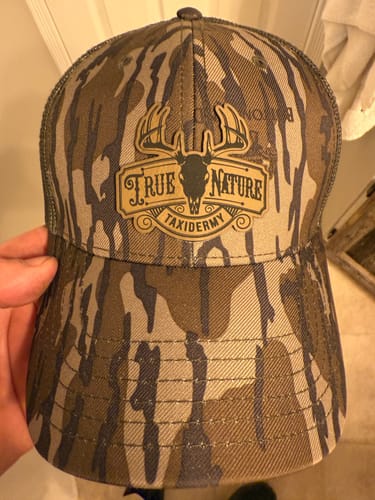 Customer photo review of [12 Pack] Mossy Oak Camouflage Leather Patch Trucker Hats
