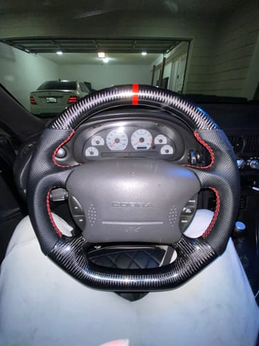 Customer photo review of (Pre Order) Carbon Fiber Flat Bottom Steering Wheel for 1994-2004 Ford Mustang SN95 & New Edge | Red Top Stripe, Black Perforated Leather, Red Stitching