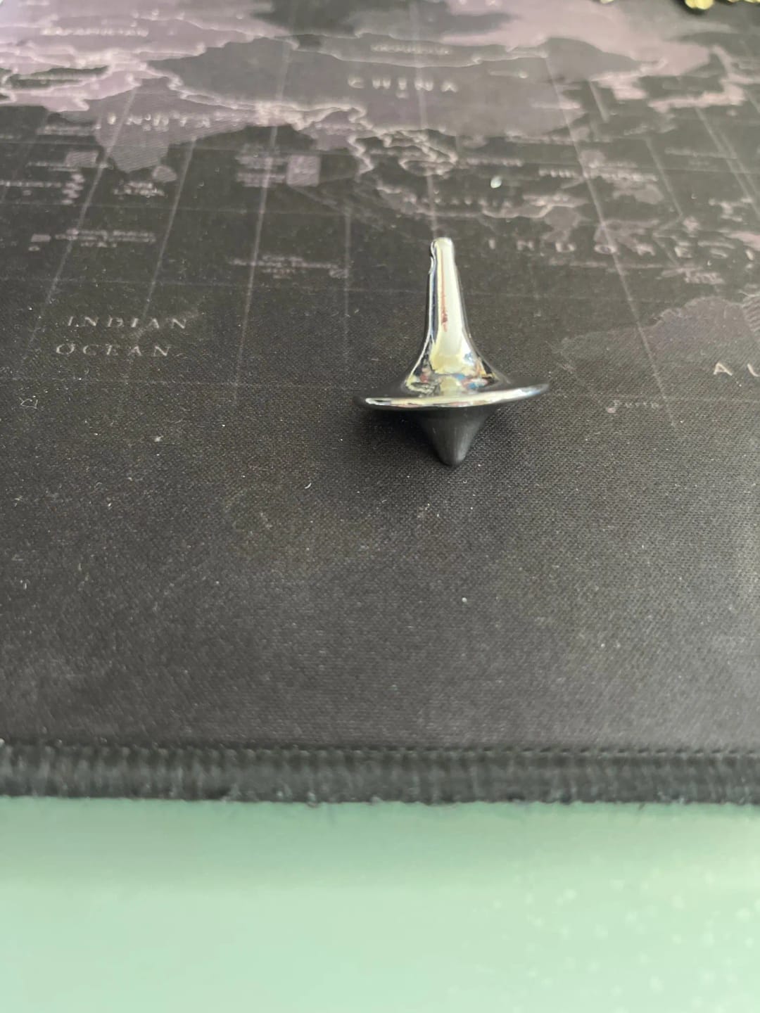 Customer photo review of Metal Gyro Spinning Top Totem Print — Silver | KIMLUD