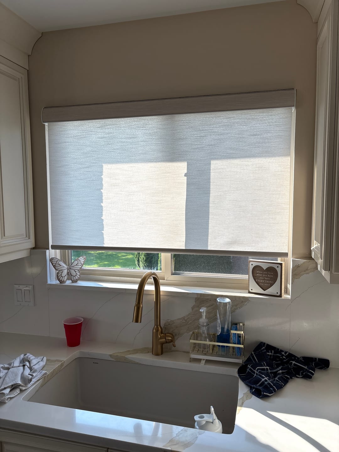 Customer photo review of SmartWings Motorized Light Filtering Roller Shades 70% Blackout Essential