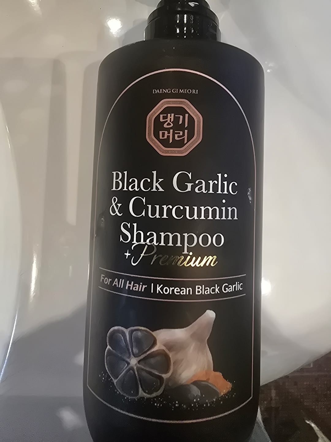 Customer photo review of Премиум анти-ейдж шампоан против косопад с Черен чесън и куркумин Doori Black Garlic and Curcumin Shampoo