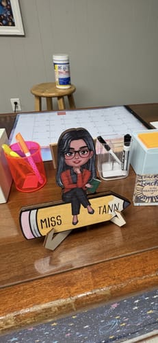 Customer photo review of Doll Teacher Sitting On Pencil Personalized 2-Layer Wooden Plaque