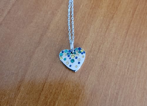 Customer photo review of DovEggs Silver & Platinum Celebration Group order confetti round moissanite/lab grown diamond/colored gem necklace pendant( Pendant ONLY) 15.5mm×14mm