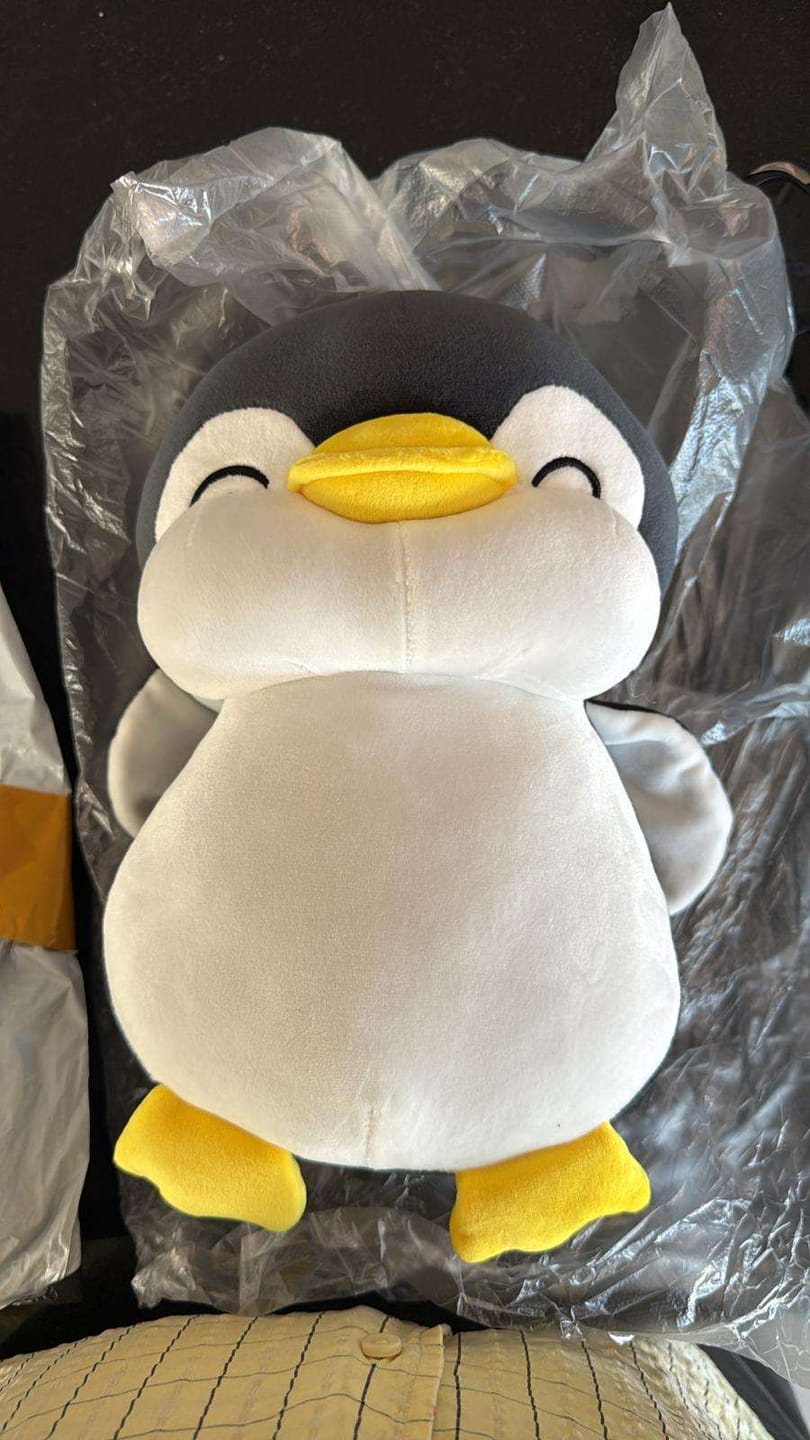 Customer photo review of Super Soft Penguin Plushie (3 COLORS, 3 SIZES) - 12″ / 30 cm / Black