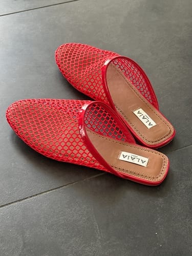 Customer photo review of ALAIA FLAT MULES IN CHERRY RED MESH FISHNET