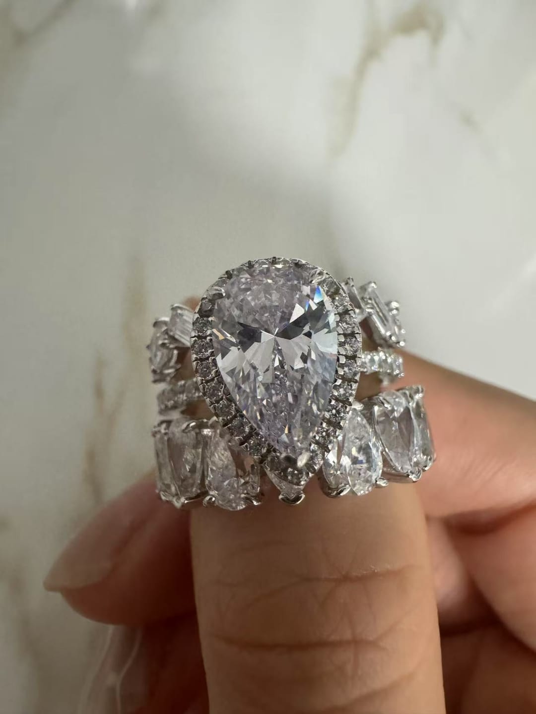 Customer photo review of S925 2.2 Carat Halo Pear Cut Wedding Ring Set With Two Luxurious Wedding Bands For Women