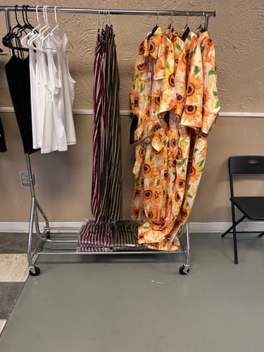 Customer photo review of PLUS SIZE SHORT SLEEVE BUTTON UP POCKETS BELTED SUNFLOWERS JUMPSUIT