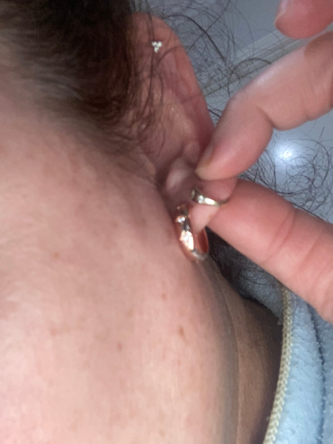 Customer photo review of North Star Thick Huggie Earrings