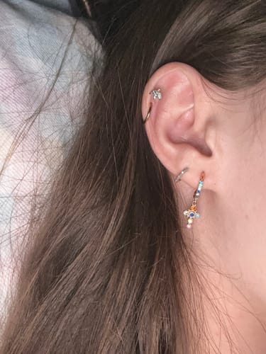 Customer photo review of Isabella Rainbow Gold Cross Huggie Earrings