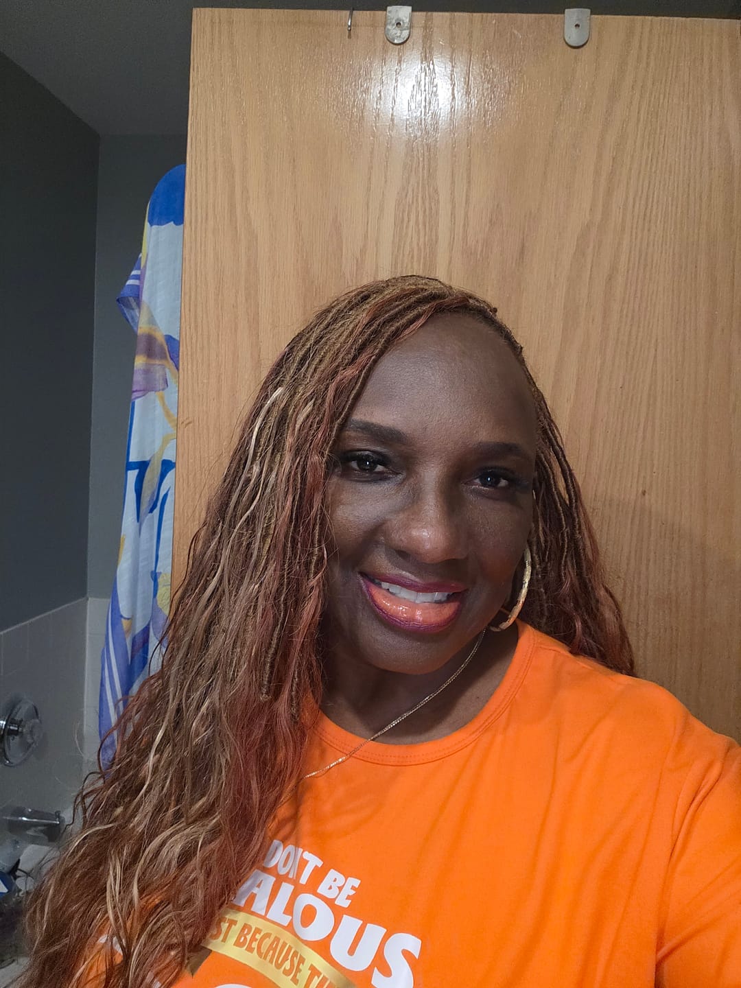 Customer photo review of Pre-looped Light Auburn Human Hair Crochet Boho Locs With Body Wave Curls