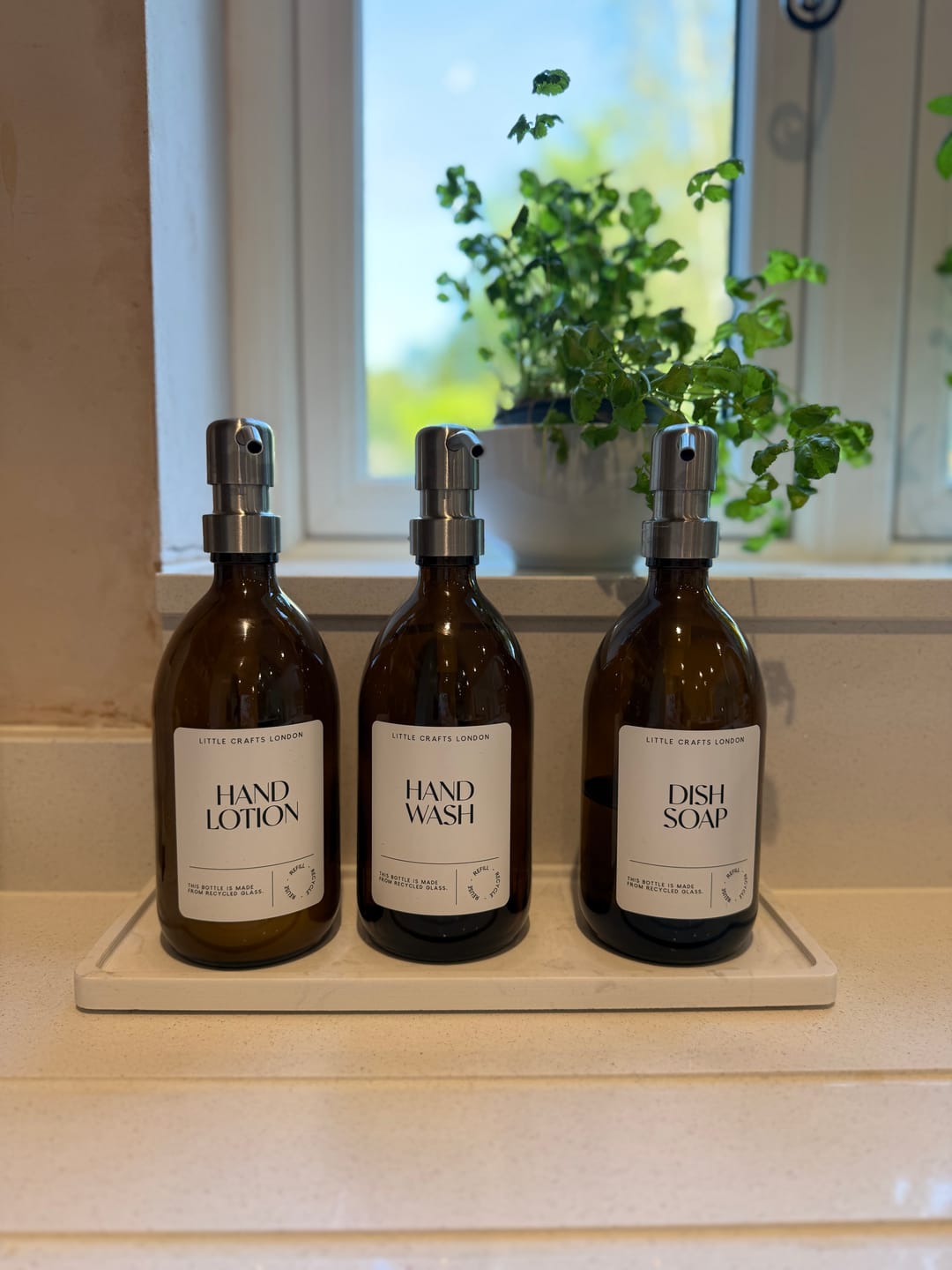 Customer photo review of Set of 3 Reusable Amber Glass Bottles 500 ML with Stainless Steel Pump and Long Tray