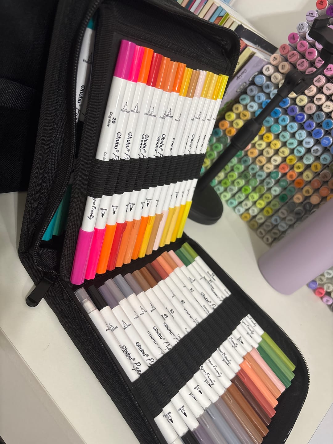 Customer photo review of Ohuhu Pupe Paper-friendly (No Peeling) Brush and Fineliner Dual Tips 60 Colors Water-based Coloring Markers