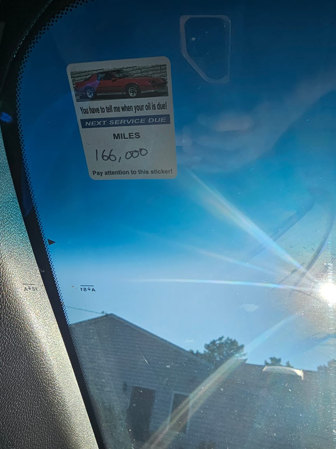 Customer photo review of Custom Oil Change Stickers for Windshield with Logo