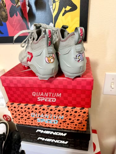 Customer photo review of Tom and Jerry "Cheddar Chase" Football Cleats - Quantum Speed by Phenom Elite