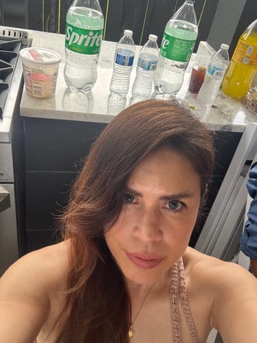 Customer with long dark hair at home, customer photo
