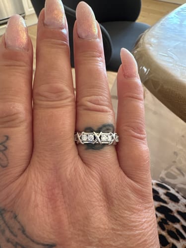Customer photo review of MOISSANITE ETERNITY X RING.