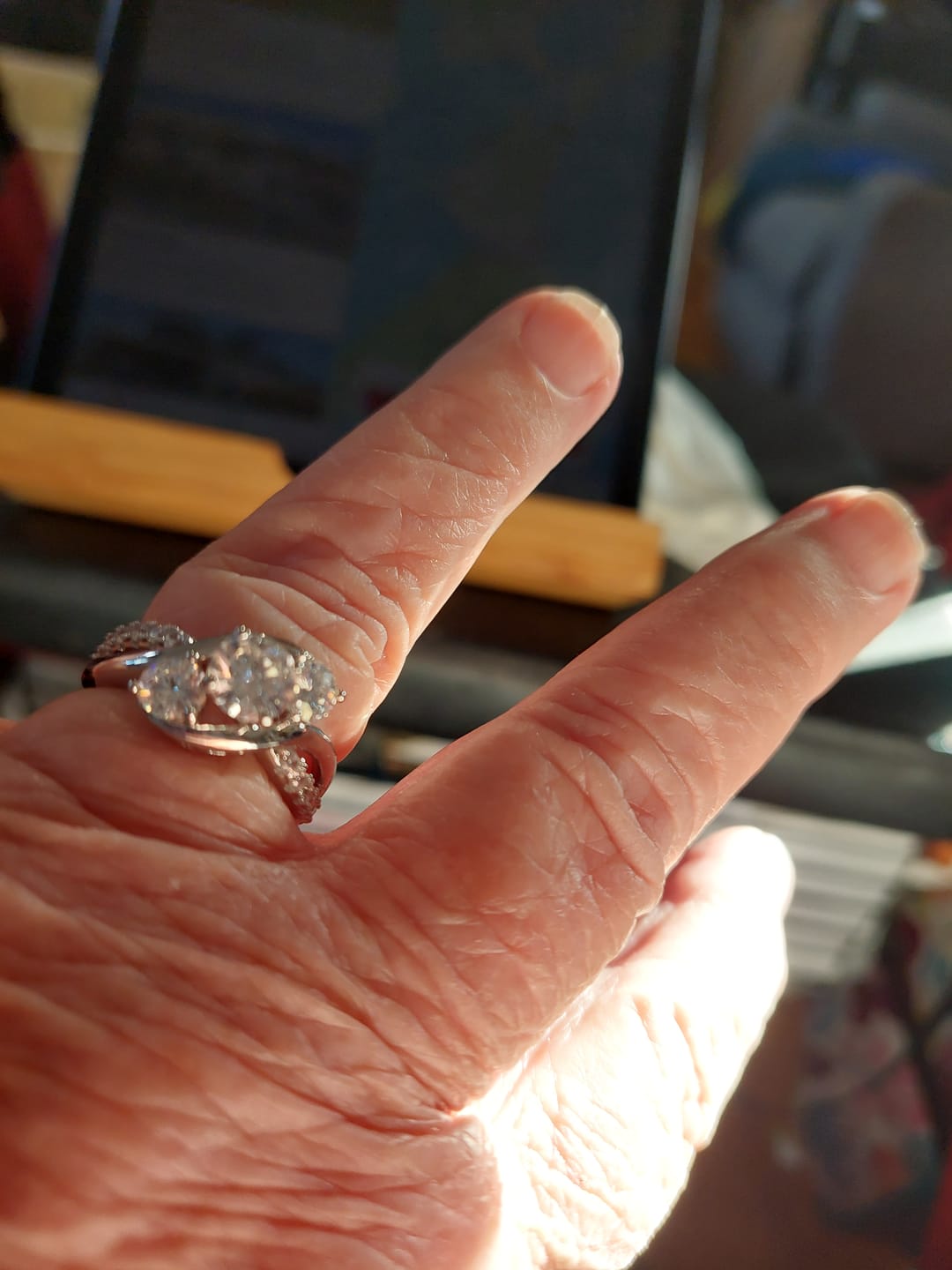 Customer photo review of Swirl Three Stone Moissanite Twisted Pave Engagement Ring