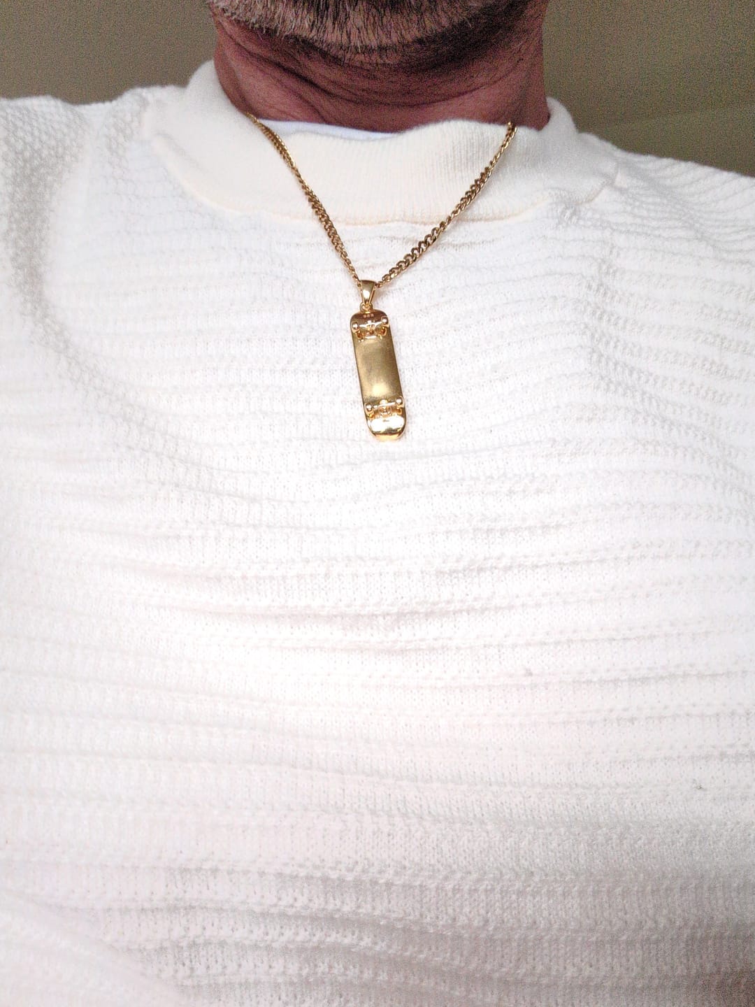 Customer photo review of Skateboard Pendant (Gold)