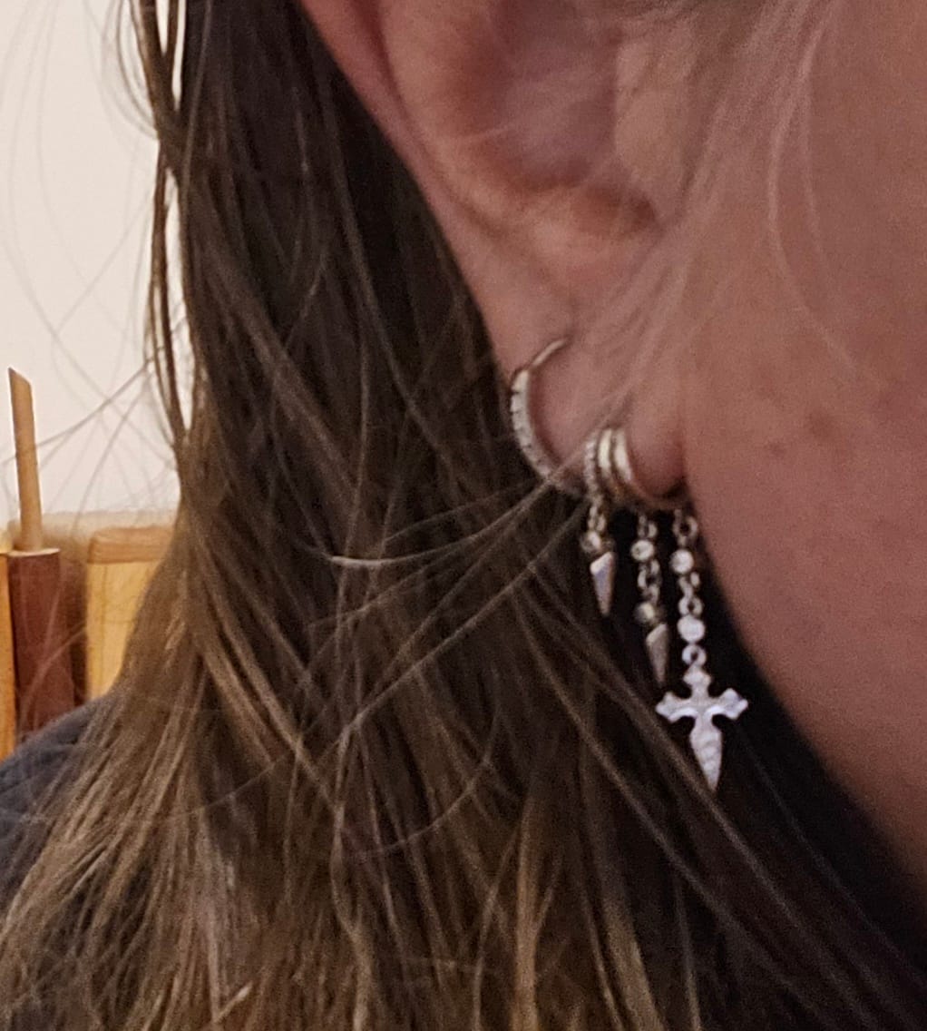 Customer photo review of Naxos Cross Illusion Earrings