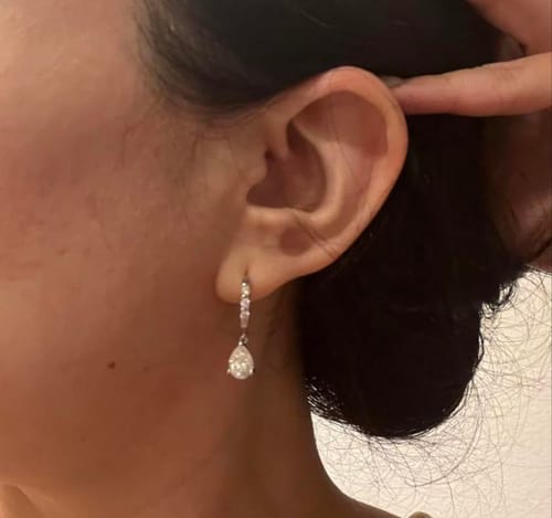 Customer photo review of Marise Pear Moissanite Drop Earrings 18K Gold Plated Sterling Silver