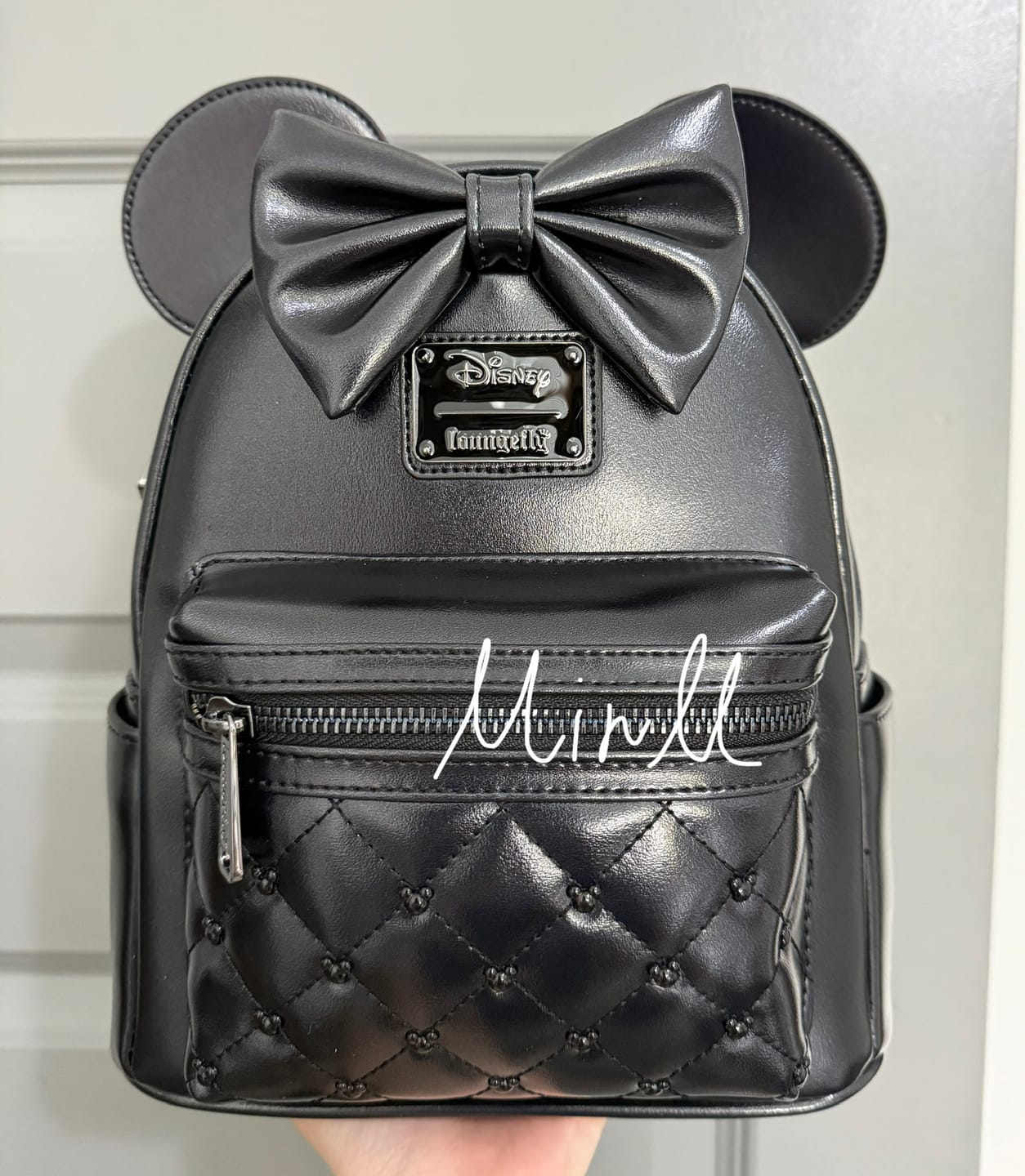 Customer photo review of Loungefly Disney The Minnie Mouse Classic Series Mini Backpack: Midnight Iridescent - 707 Street Exclusive