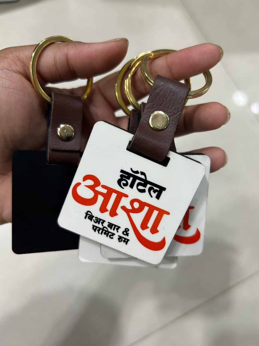 Customer photo review of Customized Premium Belt Keychains | Best for Brand Promotion | PrintMine.in