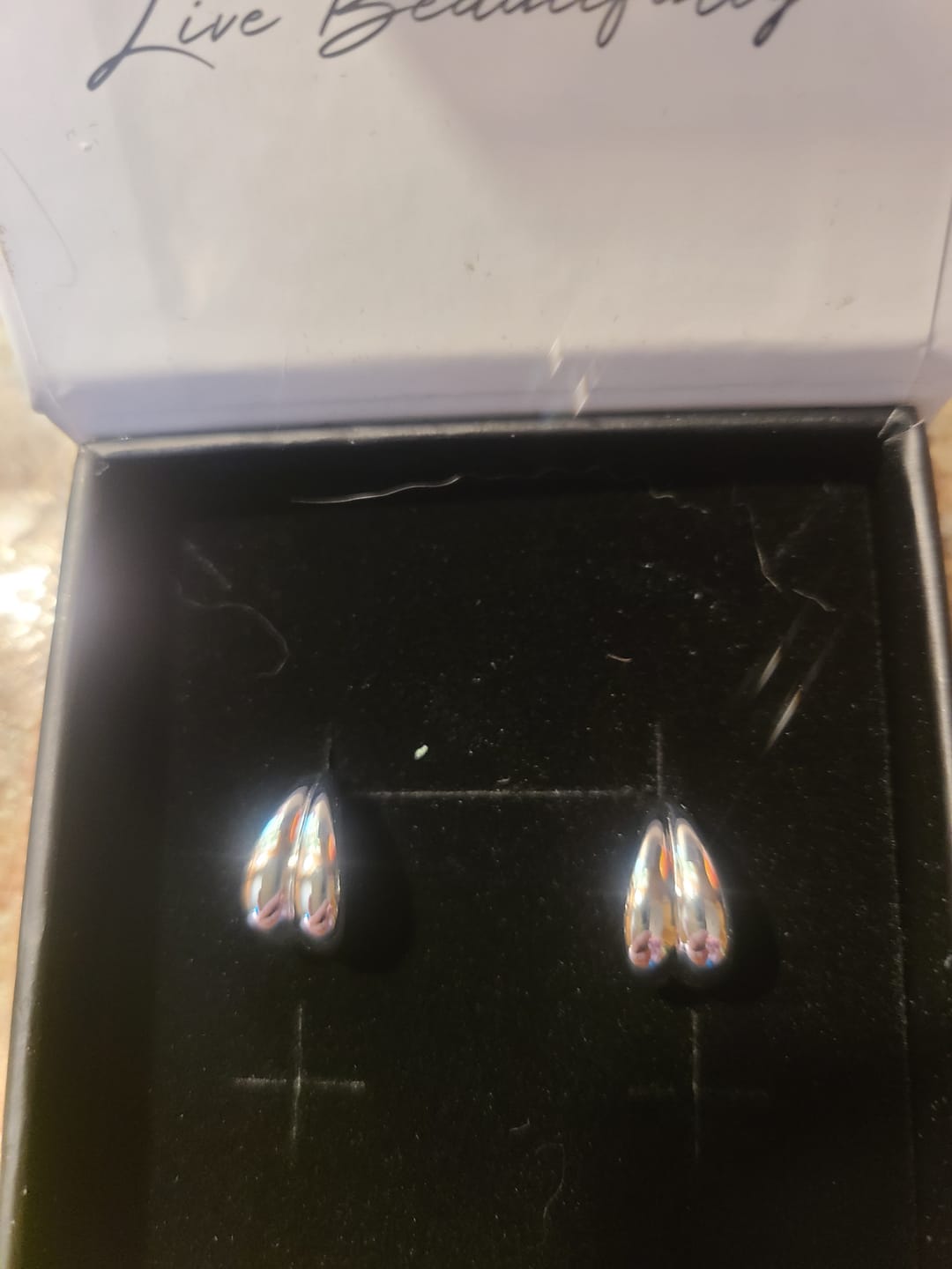 Customer photo review of Shae 18k White Gold Plated Semi-Hoop Curved Stud Earrings