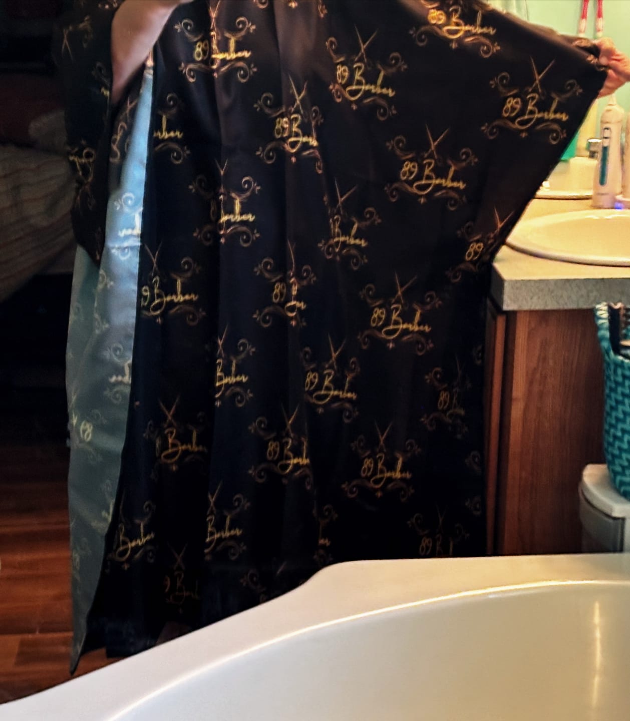Customer photo review of Custom Barber Cape- Upload Your Logo - Step And Repeat Pattern