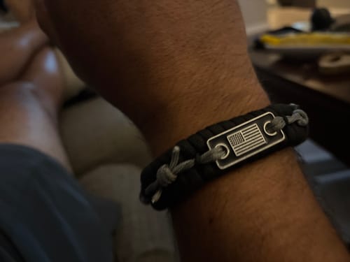 Customer photo review of Never Surrender Barbed Wire Paracord Bracelet: Helps Pair Veterans With A Service Dog Or Shelter Dog