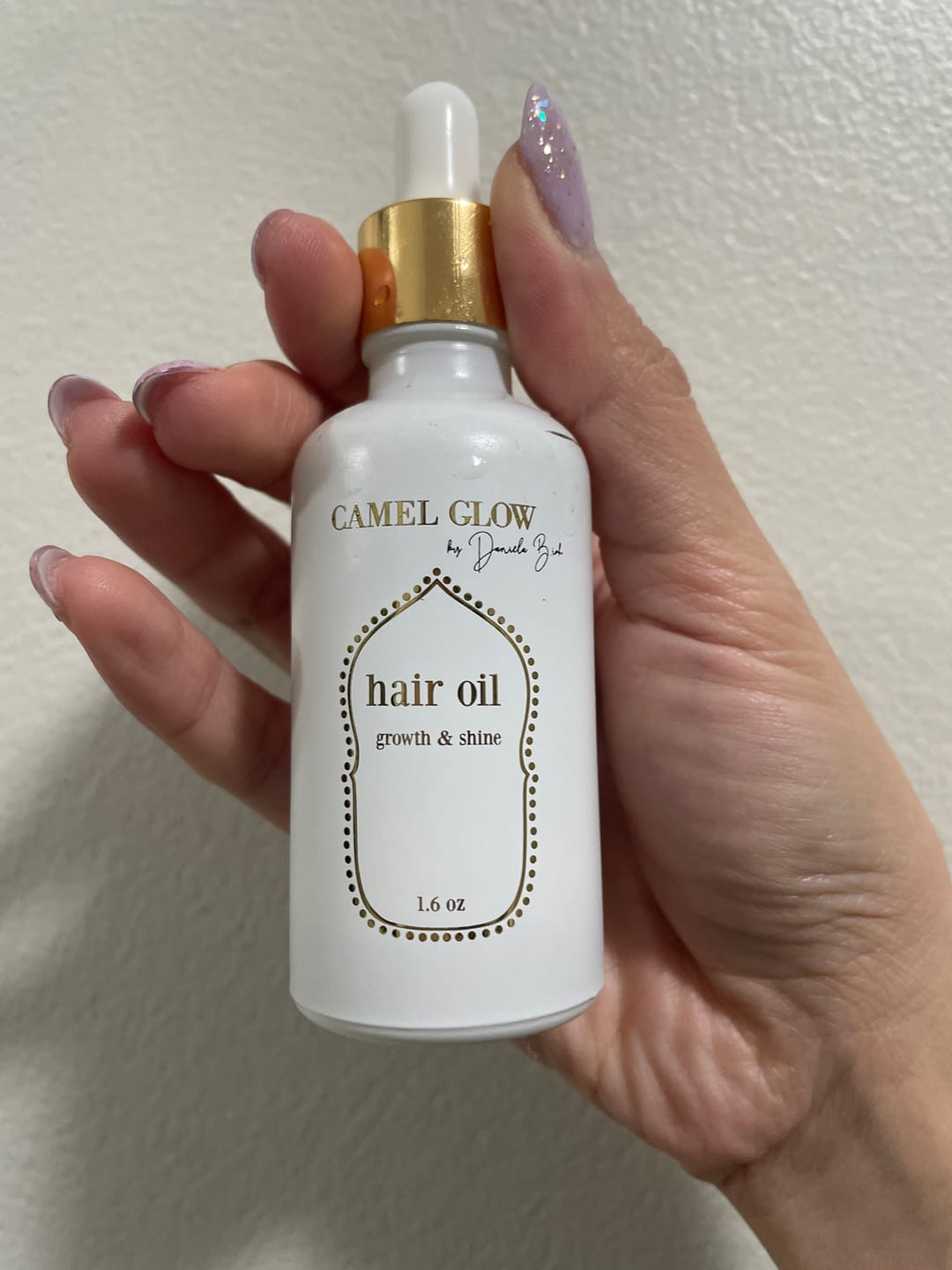 Customer photo review of Nourish & Shine Hair Oil