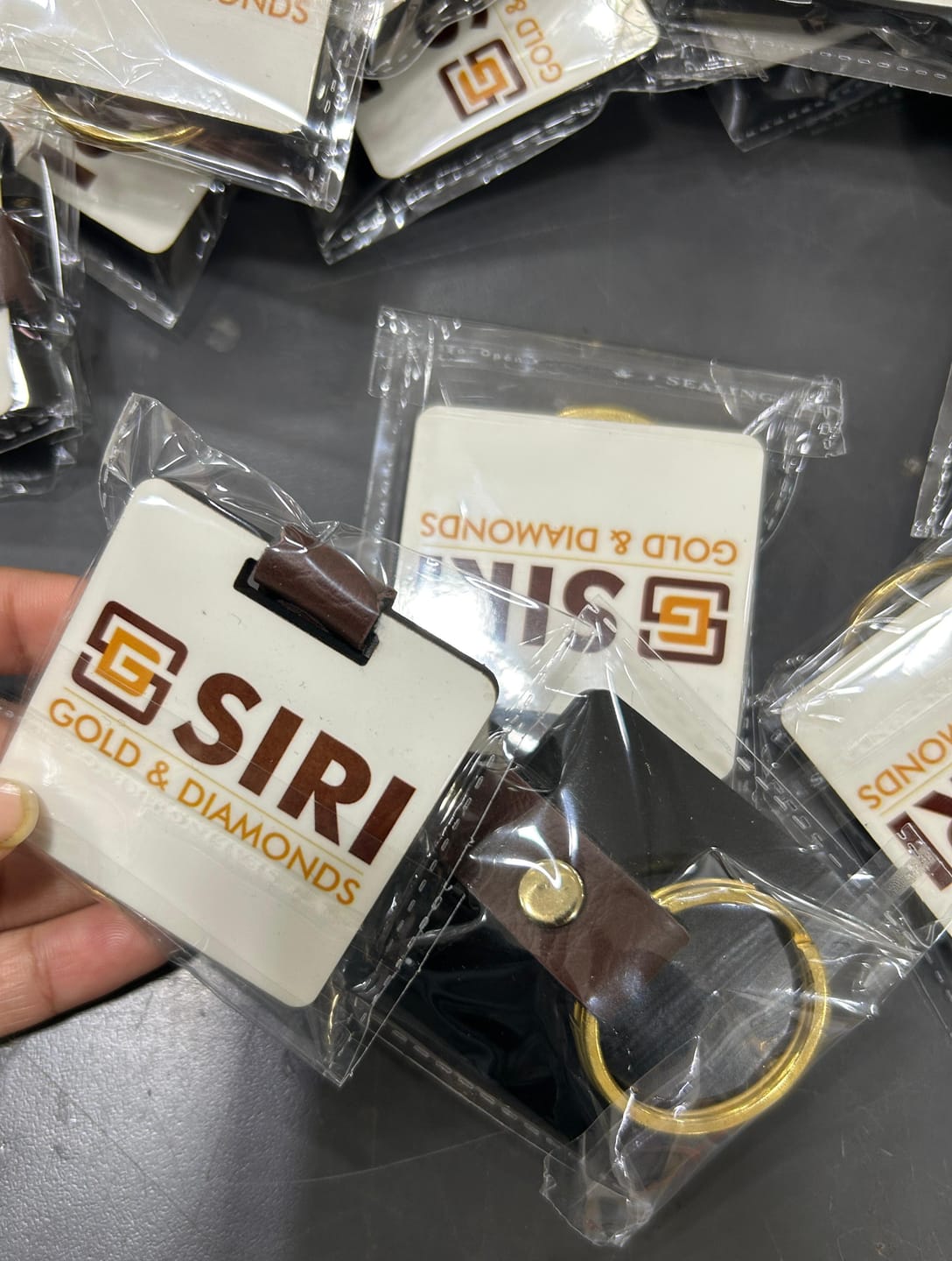 Customer photo review of Customized Premium Belt Keychains | Best for Brand Promotion | PrintMine.in