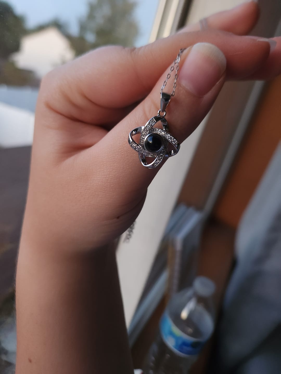 Customer photo review of Personalized Photo Projection Necklace