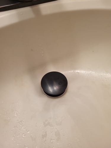 Customer photo review of Bathroom Vanity Sink Drain Stopper with Overflow Fits Bronze