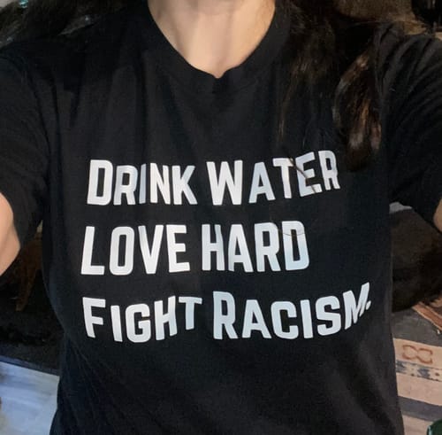 Customer photo review of Drink Water Fight Racism Unisex T-shirt