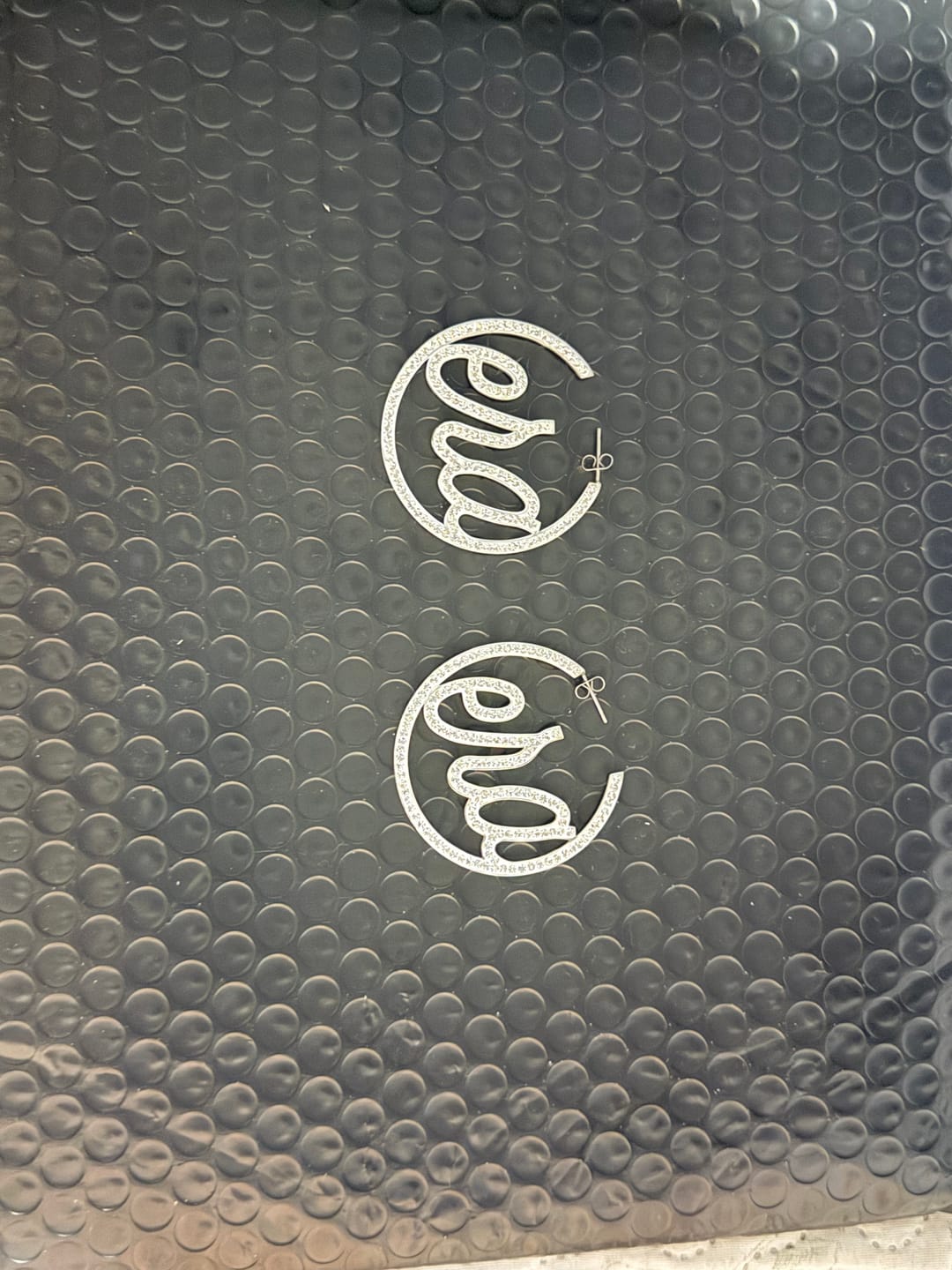 Customer photo review of Silver Luxe Logo Hoops