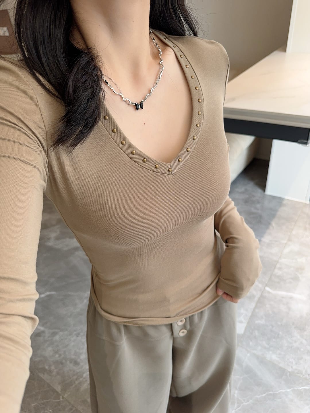 Customer photo review of IAMXIAA Studded V-Neck Long Sleeve Tee
