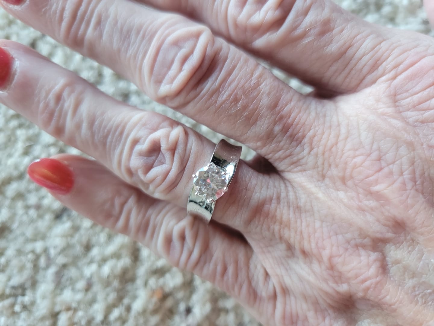 Customer photo review of Solitaire Round Moissanite Concave Wide Band Engagement Ring