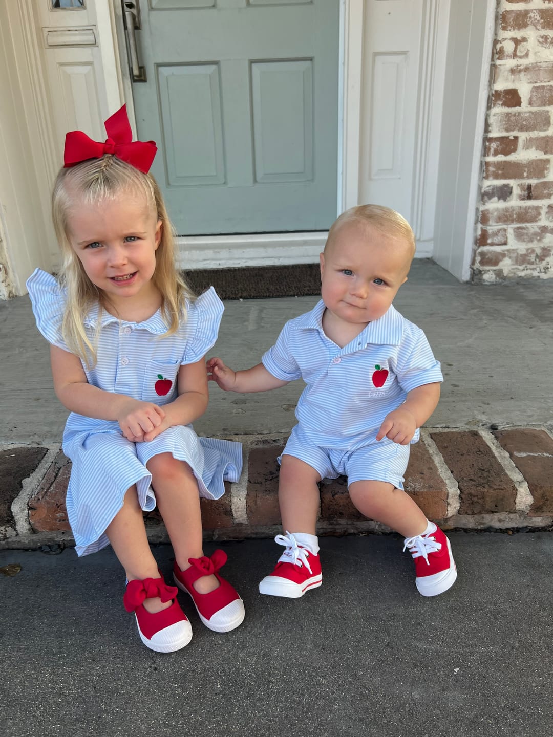 Customer photo review of Darling Apple Light Blue Stripe Polo Romper