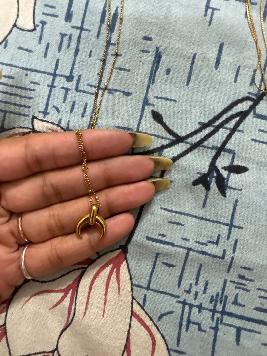 Customer photo review of Tiny Horn Necklace
