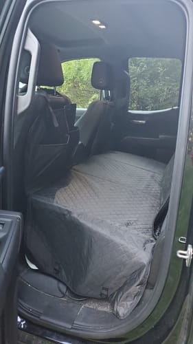 Customer photo review of NEW Waterproof Hard Bottom Car & Truck Seat Foldable Hammock Cover With Storage Pockets, Side Flaps, Headrest Straps, Seat Anchors, & Mesh Window (+FREE SAFETY BELT!)